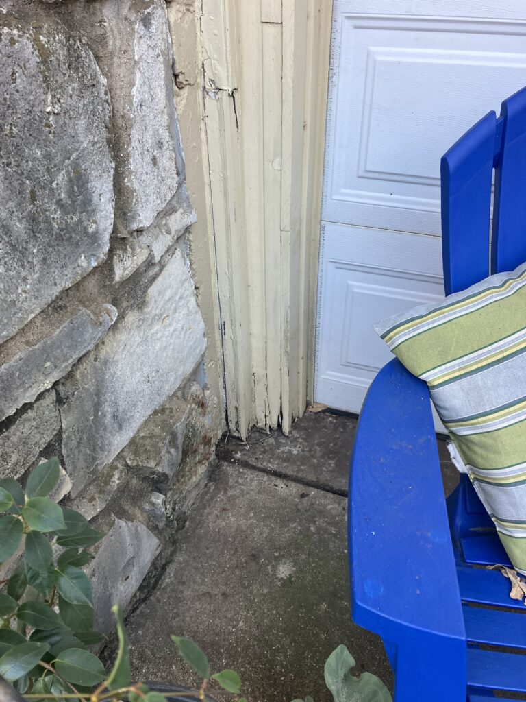 rat entry around garage damaged wall